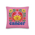 A square pink pillowcase features a vibrant, multi-colored design centered around a yellow and red crab representing the Cancer zodiac sign. The design is framed by symmetrical green leaves and yellow and red flowers. The word "cancer" is written in a bold, blue, rounded font at the bottom. The visual texture mimics intricate raised embroidery with visible stitch patterns, though the surface is a smooth 2D print on a linen-textured polyester fabric with a hidden zipper.