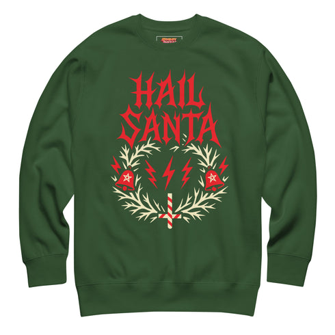 A unisex crewneck sweatshirt shown in red, green, and blue color options. The graphic features "HAIL SANTA" in a red, jagged, heavy metal-style font. The text is framed by a cream-colored wreath made of thorny branches. Inside the wreath are two red lightning bolts and two red bells with cream-colored pentagrams. An inverted candy cane cross sits at the bottom. This alternative holiday sweater has fleece texture, ribbed cuffs, and a classic fit, designed for goth, punk, and metalhead aesthetics.