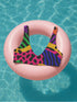 Colorblock animal print bikini top with neon pink, orange, green, purple, and blue abstract pattern. Scoop neck cut with wide straps, removable padding, double-layered fabric, UPF 50+, and made from soft, stretchy recycled polyester-spandex blend.