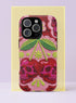 Dual layer matte phone case with a high fidelity 2D print that creates a hyper realistic faux crochet and knit illusion. The central design shows two conjoined cherries styled as bright pink and burgundy human skulls with lime green stems and leaves. The background is a detailed scalloped lace doily pattern in hot pink, deep red, and lime green. Matte finish shell with a black inner TPU lining, precise camera cutout, and open ports. Pastel goth macabre alt fashion phone accessory, made to order.