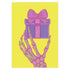 Birthday card with vibrant yellow background. A pink and green skeletal hand holds a purple and pink gift box with large pink bow. The illustration blends festive and spooky elements, creating a playful Halloween-meets-birthday aesthetic. The stylized, colorful design uses contrasting bright colors for a eye-catching effect. Inside message reads: 'Unwrap the Magic. Embrace the Spook. It's Your Day to Shine!' - combining celebratory spirit with a touch of the macabre for a unique birthday greeting.