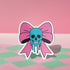 Pastel goth skull bow sticker with a blue skull and pink bow, perfect for creepy cute and punk lovers. Available in Prism, Gem, and Glitter finishes. Handmade in Austin, Texas.