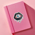 Eyeball vampire fangs sticker with black lips, perfect for adding a spooky touch to laptops, phones, and water bottles. Available in Prism, Gem, and Glitter finishes. Handmade in Austin, Texas.