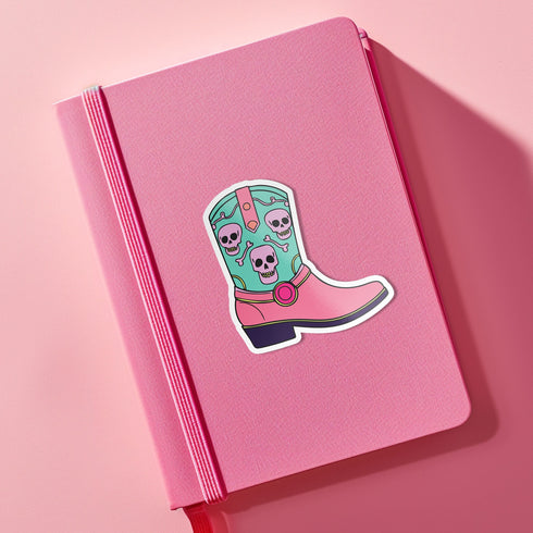 Colorful Goth Cowgirl Boot Sticker with teal and pink boot and skulls, perfect for adding a spooky and quirky touch to your belongings.