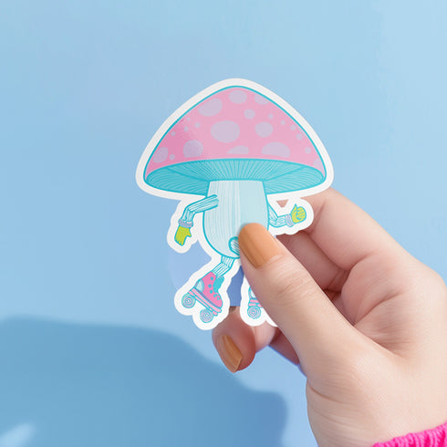 Adorable mushroom sticker with pink roller skates and neon gloves, ideal for roller skate enthusiasts and quirky design lovers. Available in Prism, Gem, and Glitter finishes. Handmade in Austin, Texas.