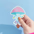 Adorable mushroom sticker with pink roller skates and neon gloves, ideal for roller skate enthusiasts and quirky design lovers. Available in Prism, Gem, and Glitter finishes. Handmade in Austin, Texas.