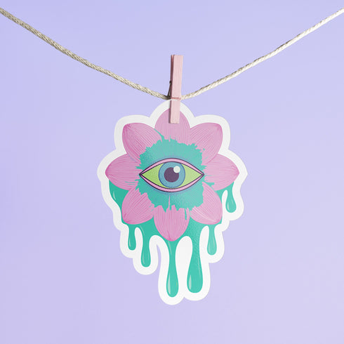 Trippy eyeball flower sticker in pastel pink and green, ideal for quirky and weirdcore enthusiasts. Available in Prism, Gem, and Glitter finishes. Handmade in Austin, Texas.