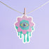 Trippy eyeball flower sticker in pastel pink and green, ideal for quirky and weirdcore enthusiasts. Available in Prism, Gem, and Glitter finishes. Handmade in Austin, Texas.