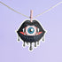 Eyeball vampire fangs sticker with black lips, perfect for adding a spooky touch to laptops, phones, and water bottles. Available in Prism, Gem, and Glitter finishes. Handmade in Austin, Texas.