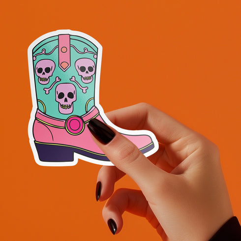 Colorful Goth Cowgirl Boot Sticker with teal and pink boot and skulls, perfect for adding a spooky and quirky touch to your belongings.