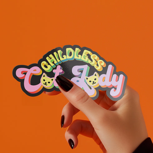 Bold "Childless Cat Lady" sticker with sassy typography and cat silhouettes, embodying feminist political pride.