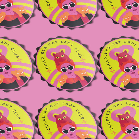 Vibrant oval sticker reading "Childless Cat Lady Club". Features cartoon woman with sunglasses surrounded by cats. Bold retro design in pink, yellow, and red.