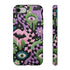 Dual layer phone case in matte or glossy with a 2D print that mimics thick crochet and yarn embroidery. Black bats, pink and green dripping slime, all-seeing eyes with lashes, purple and green daisies, and twisting pink and black checkered worms scatter across a black knit-look background. Smooth printed surface with no raised threads, open ports, and camera cutout. Pastel goth, creepy cute, whimsigoth, spooky maximalist phone accessory and gift.