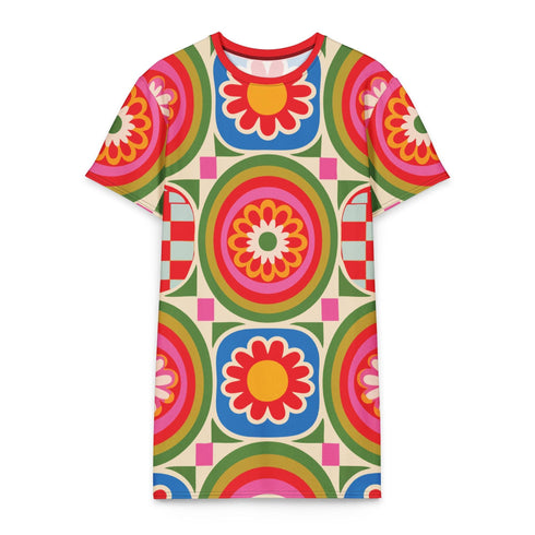 Short sleeve crew neck t-shirt dress in a relaxed, oversized straight cut, made of 100% polyester with a soft matte finish. An edge-to-edge all-over print on a cream background shows 60s daisies in red, yellow, and white set inside concentric rings of lime green, hot pink, orange, and royal blue, with magenta squares and red checkerboard accents. Retro 60s mod, flower power, rainbow maximalist alt fashion.