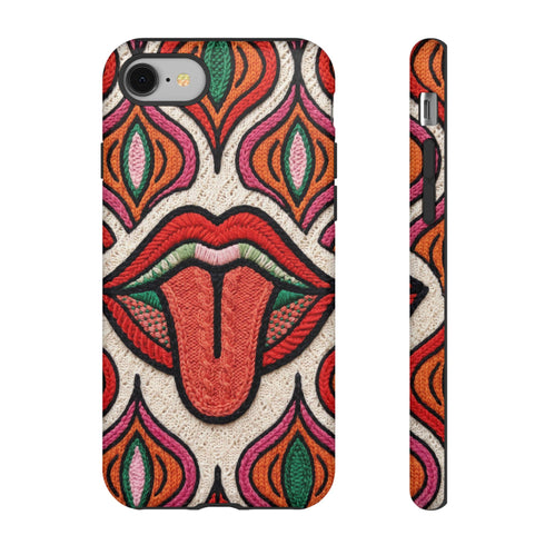 Dual layer matte phone case with a 2D print that mimics heavy crochet and thick knit yarn. A large open mouth with bright red lips and a red tongue sticking out sits at the center of a cream background, surrounded by mirrored teardrop and flame shapes in bright orange, dark green, and hot pink with black stitch-style outlines. Smooth printed surface with no raised threads, open ports, and camera cutout. Psychedelic 70s pop art phone accessory.