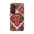 Dual layer matte phone case with a 2D print that mimics heavy crochet and thick knit yarn. A large open mouth with bright red lips and a red tongue sticking out sits at the center of a cream background, surrounded by mirrored teardrop and flame shapes in bright orange, dark green, and hot pink with black stitch-style outlines. Smooth printed surface with no raised threads, open ports, and camera cutout. Psychedelic 70s pop art phone accessory.