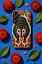 Dual layer matte phone case with a 2D print that mimics thick crewel embroidery. An angry black possum with a white face, bared sharp teeth, and bright red eyes and claws sits at the center on a cream background, framed by a symmetrical border of red folk art daisies with yellow centers and green leaves. Smooth printed surface with no raised threads, open ports, and a precise camera cutout. Goblincore, creepy cute, maximalist phone accessory.