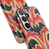 Dual layer matte phone case with a 2D print that mimics thick, heavy crochet yarn. Rows of stacked black bats repeat across a vibrant rust-orange background, accented with bright pink faux yarn bobbles and framed by cream arched lines. Smooth printed surface with no raised threads, open ports, and a precise camera cutout. Pastel goth, creepy cute, Summerween and Halloween phone accessory with a cozy handmade look.