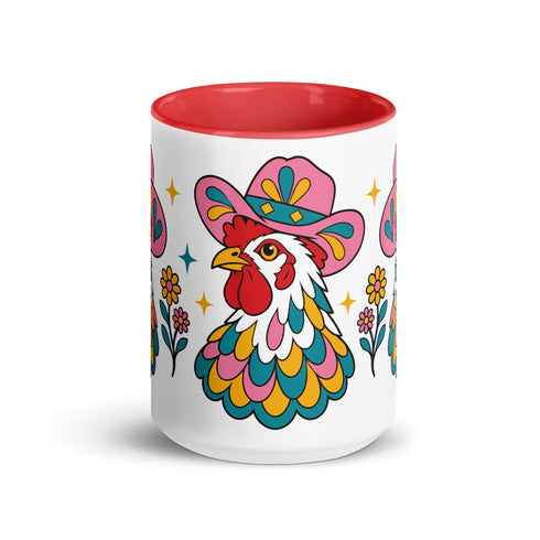 Glossy white ceramic coffee mug with a colored rim, inside, and handle and a full wraparound folk art print. Chickens wear pink cowboy hats with teal bands, yellow diamonds, flowers, and teardrop motifs. The birds have white heads, red combs and wattles, and layered pink, teal, and golden yellow feathers outlined in black. Pink and yellow flowers, teal leaves, and four-point starbursts fill the space between. Retro western kitchen decor.