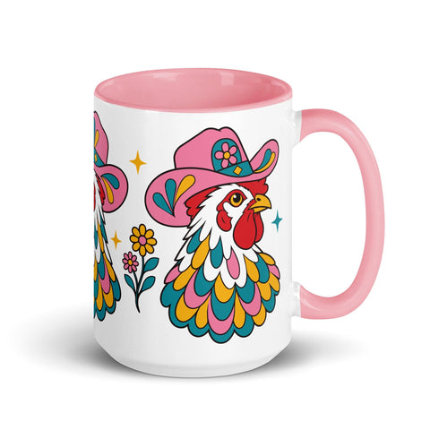 Glossy white ceramic coffee mug with a colored rim, inside, and handle and a full wraparound folk art print. Chickens wear pink cowboy hats with teal bands, yellow diamonds, flowers, and teardrop motifs. The birds have white heads, red combs and wattles, and layered pink, teal, and golden yellow feathers outlined in black. Pink and yellow flowers, teal leaves, and four-point starbursts fill the space between. Retro western kitchen decor.