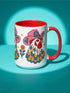Glossy white ceramic coffee mug with a colored rim, inside, and handle and a full wraparound folk art print. Chickens wear pink cowboy hats with teal bands, yellow diamonds, flowers, and teardrop motifs. The birds have white heads, red combs and wattles, and layered pink, teal, and golden yellow feathers outlined in black. Pink and yellow flowers, teal leaves, and four-point starbursts fill the space between. Retro western kitchen decor.