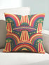 Square 70s psychedelic throw pillow cover printed to look like textured embroidery on a dark, starry navy background. Retro flying saucers and stylized alien eyes repeat across the design above rainbow arches, with small yellow stars and beams of light. Smooth flat 2D print, not raised stitching. Trippy, groovy, retro space age maximalist decor for a sofa, dorm bed, or reading nook, made for sci-fi fans and alien lovers.