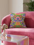 Square weirdcore throw pillow cover printed to look like textured crewel embroidery on a green background. A pink and blue flying saucer with one large blue eye at its center hovers among floating blue eyeballs and red hearts. Smooth flat 2D print, not raised stitching. Maximalist, trippy sci-fi dopamine decor with quirky alien charm for a sofa, dorm bed, gaming chair, or reading nook, made for space lovers and sci-fi fans.