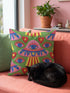 Square weirdcore throw pillow cover printed to look like textured crewel embroidery on a green background. A pink and blue flying saucer with one large blue eye at its center hovers among floating blue eyeballs and red hearts. Smooth flat 2D print, not raised stitching. Maximalist, trippy sci-fi dopamine decor with quirky alien charm for a sofa, dorm bed, gaming chair, or reading nook, made for space lovers and sci-fi fans.