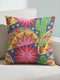 Square maximalist throw pillow cover printed to look like bold crewel embroidery on a solid royal blue background. Tacos with green, red, and brown fillings scatter across the design with bright green saguaro cacti, large pink and red starburst flowers, and small yellow stars. Smooth flat 2D print, not raised stitching. Colorful, quirky dopamine decor for a sofa, kitchen bench, or breakfast nook, made for taco lovers and foodies.