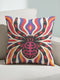 Square psychedelic folk art throw pillow cover printed to look like textured embroidery on a cream background. A large black spider with coral red and magenta markings on its legs and abdomen sits at the center, surrounded by rippling waves in blue violet, coral red, magenta, and golden yellow. Smooth flat 2D print, not raised stitching. Retro gothic Halloween maximalist decor for a sofa, armchair, or goth bedroom, made for spooky season.