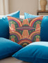 Square 70s psychedelic throw pillow cover printed to look like textured embroidery on a dark, starry navy background. Retro flying saucers and stylized alien eyes repeat across the design above rainbow arches, with small yellow stars and beams of light. Smooth flat 2D print, not raised stitching. Trippy, groovy, retro space age maximalist decor for a sofa, dorm bed, or reading nook, made for sci-fi fans and alien lovers.