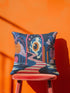 Square surreal liminal space throw pillow cover printed to look like textured embroidery on a dark navy background. A giant blue and white eyeball planet with an orange iris glows inside pink stone arches above a pink and white striped staircase curving over dark blue water, with lavender clouds, blue aqueduct arches, and orange potted palms. Smooth flat 2D print, not raised stitching. Psychedelic dreamscape decor for a sofa, bedroom chair, or reading nook.
