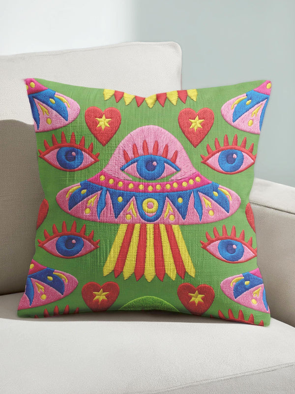 Square weirdcore throw pillow cover printed to look like textured crewel embroidery on a green background. A pink and blue flying saucer with one large blue eye at its center hovers among floating blue eyeballs and red hearts. Smooth flat 2D print, not raised stitching. Maximalist, trippy sci-fi dopamine decor with quirky alien charm for a sofa, dorm bed, gaming chair, or reading nook, made for space lovers and sci-fi fans.