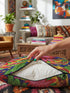 Square maximalist throw pillow cover printed to look like bold crewel embroidery on a solid royal blue background. Tacos with green, red, and brown fillings scatter across the design with bright green saguaro cacti, large pink and red starburst flowers, and small yellow stars. Smooth flat 2D print, not raised stitching. Colorful, quirky dopamine decor for a sofa, kitchen bench, or breakfast nook, made for taco lovers and foodies.