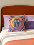 Square celestial throw pillow cover printed to look like heavy satin-stitch embroidery. A glowing yellow crescent sun and a lavender purple moon face a cosmic third eye, above a winding purple staircase that climbs to a starry archway framed by pink clouds and rayed sunbursts. Smooth flat 2D print, not raised stitching. Mystical, witchy, boho maximalist decor for a sofa, bed, reading nook, or altar corner, made for astrology lovers and tarot readers.