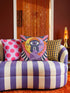 Square celestial throw pillow cover printed to look like heavy satin-stitch embroidery. A glowing yellow crescent sun and a lavender purple moon face a cosmic third eye, above a winding purple staircase that climbs to a starry archway framed by pink clouds and rayed sunbursts. Smooth flat 2D print, not raised stitching. Mystical, witchy, boho maximalist decor for a sofa, bed, reading nook, or altar corner, made for astrology lovers and tarot readers.