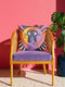 Square celestial throw pillow cover printed to look like heavy satin-stitch embroidery. A glowing yellow crescent sun and a lavender purple moon face a cosmic third eye, above a winding purple staircase that climbs to a starry archway framed by pink clouds and rayed sunbursts. Smooth flat 2D print, not raised stitching. Mystical, witchy, boho maximalist decor for a sofa, bed, reading nook, or altar corner, made for astrology lovers and tarot readers.