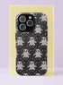 Front view of a dual layer tough phone case printed edge to edge with rows of kawaii ghosts on a black background. Each little ghost has a soft white and pale lilac knit style texture, wavy edges, and simple black oval eyes and mouth, floating among tiny stars in green, pink, purple, and silver. Cute, spooky, and cozy like a Halloween sweater. Creepy cute ghost phone accessory with open ports, dual layer protection, and a precise camera cutout.