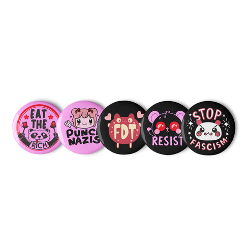 A set of five glossy round pinback buttons with pastel goth and kawaii punk designs, featuring slogans like "Eat The Rich" and "Stop Fascism" in bold pink and black. Each pin has a cute character with a rebellious message.