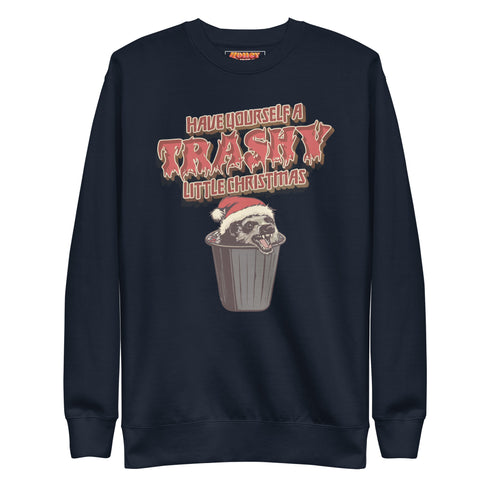 Holiday jumper sweatshirt with "HAVE YOURSELF A TRASHY LITTLE CHRISTMAS" text above a possum wearing a Santa hat, peeking out of a garbage can. Bold, punk-style lettering in red and yellow.