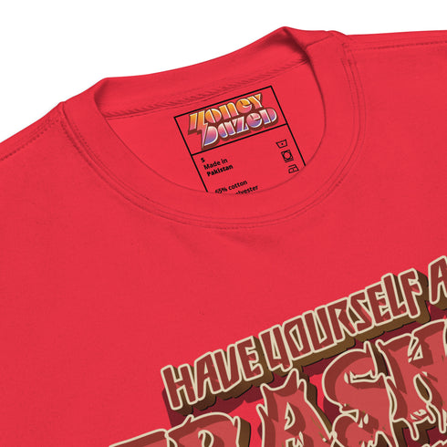 Holiday jumper sweatshirt with "HAVE YOURSELF A TRASHY LITTLE CHRISTMAS" text above a possum wearing a Santa hat, peeking out of a garbage can. Bold, punk-style lettering in red and yellow.