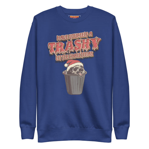 Holiday jumper sweatshirt with "HAVE YOURSELF A TRASHY LITTLE CHRISTMAS" text above a possum wearing a Santa hat, peeking out of a garbage can. Bold, punk-style lettering in red and yellow.