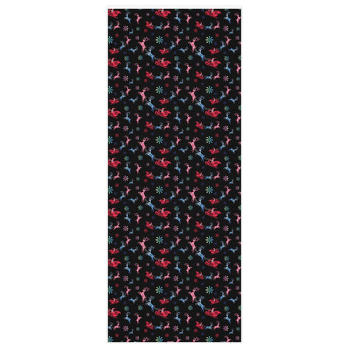 Christmas wrapping paper with a black background featuring colorful, stylized reindeer and Santa's sleigh designs. The reindeer and sleigh silhouettes are filled with skeletal patterns in shades of blue, pink, and red. Multicolored snowflakes in various sizes are scattered throughout. The paper has a whimsical, slightly gothic aesthetic that blends traditional holiday imagery with a unique, edgy twist.