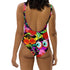 A colorful one-piece swimsuit features a vibrant, quirky pattern with cherries, cartoon eyes, and playful designs on a dark background.