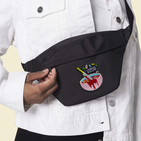 Patch featuring a bowl of cereal with a dripping knife and the text 'Cereal Killer,' set against a light pink background. The design combines playful cereal elements with a humorous, spooky twist.