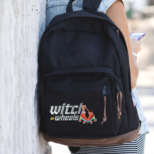 Patch with the text 'Witch on Wheels' featuring roller skates with witch's legs, set against a vibrant red background. The design combines playful witchcraft elements with a fun, retro skating theme.