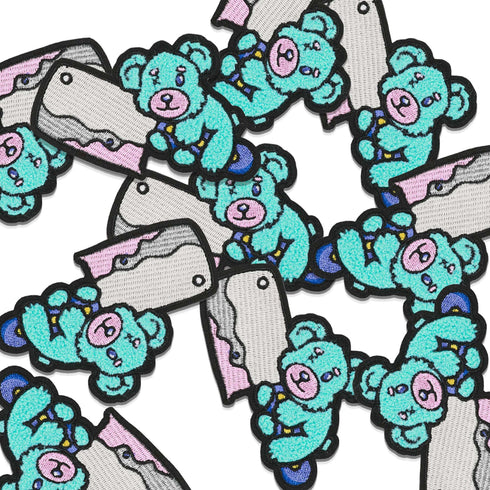 Patch featuring a teal bear holding a large cleaver knife. The design is bold and edgy, combining cute and punk elements.