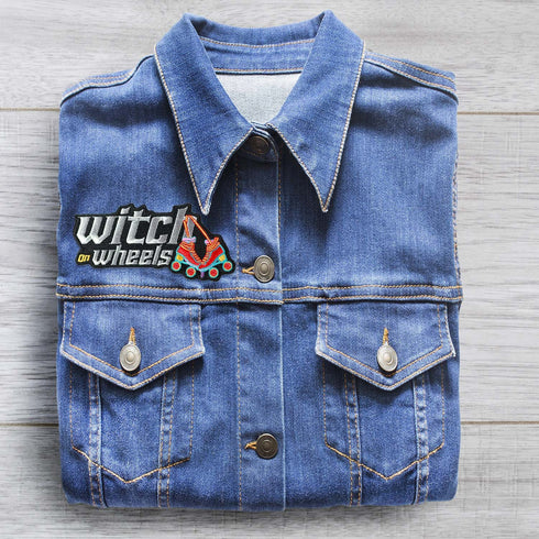 Patch with the text 'Witch on Wheels' featuring roller skates with witch's legs, set against a vibrant red background. The design combines playful witchcraft elements with a fun, retro skating theme.