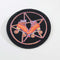 Patch featuring orange roller skates over a purple pentagram, set against a black background. The design combines playful skating elements with a mystical, witchy twist.