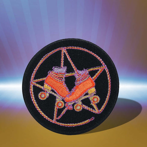 Patch featuring orange roller skates over a purple pentagram, set against a black background. The design combines playful skating elements with a mystical, witchy twist.